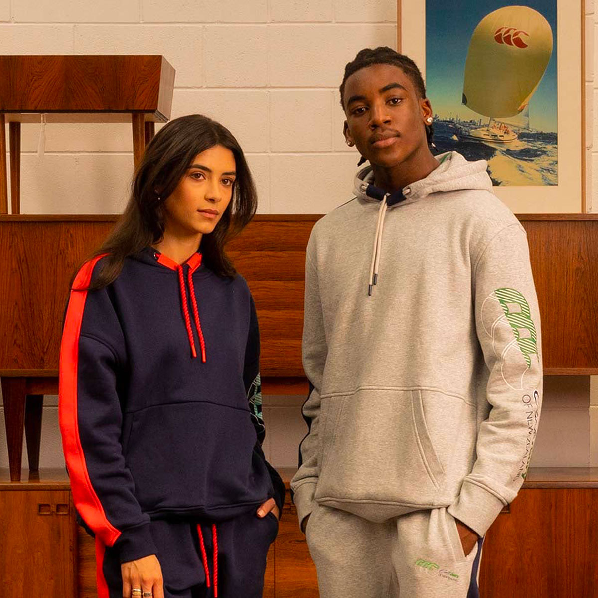 Photo of two people, both wearing Canterbury clothing